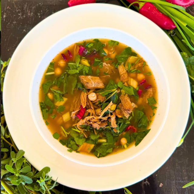 Black pork soup with chard and chickpeas.